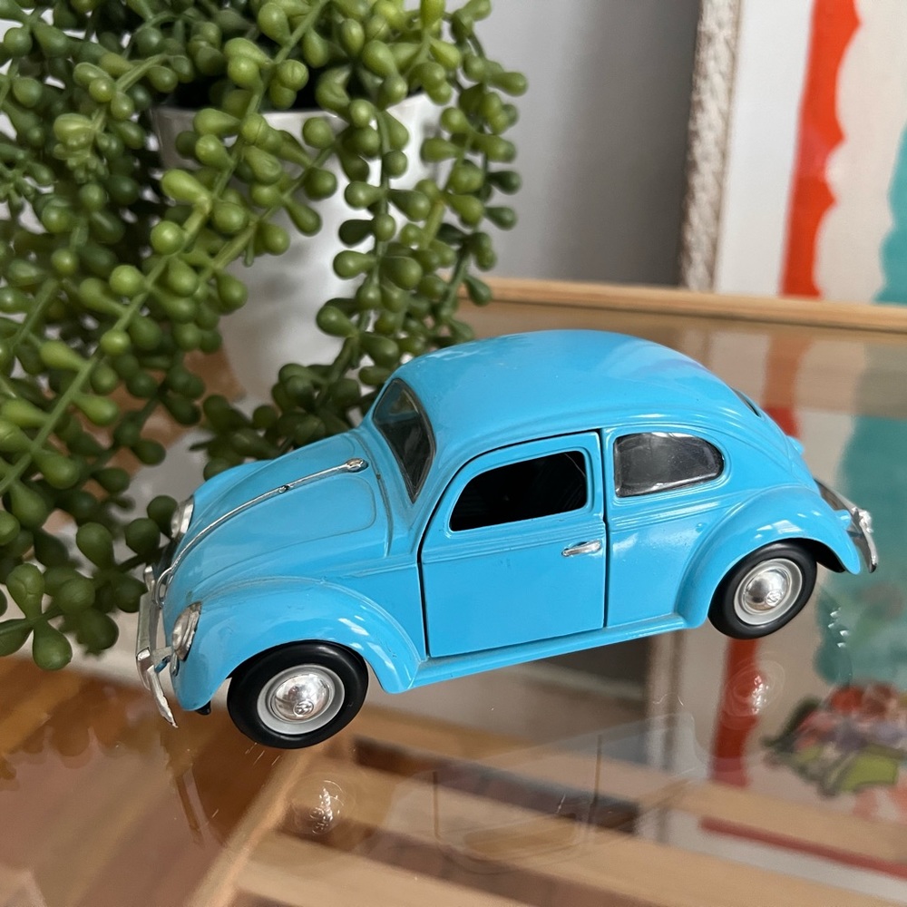 Turquoise blue punch buggy toy figurine